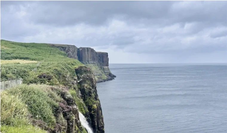 Green cliffs above the sea
