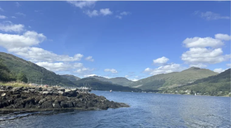 A loch with hills on both sides