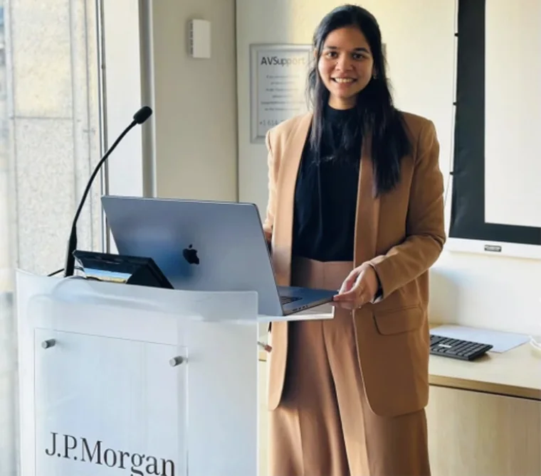 Ashita presenting at a J.P.Morgan lectern